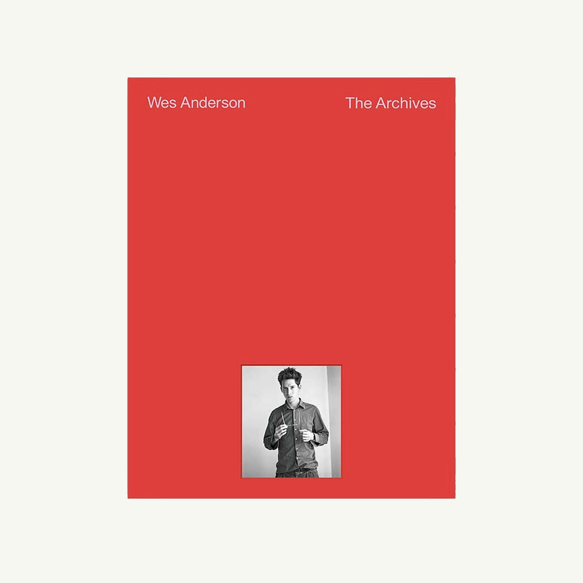 Red cover Wes Anderson: The Archives by ARTBOOK | D.A.P.; includes archives, portrait below.