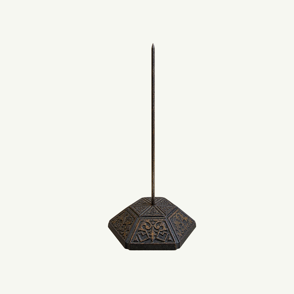 Antique Desk Paper Spike by Mr. Boddington’s Studio with hexagonal cast iron base, white backdrop.