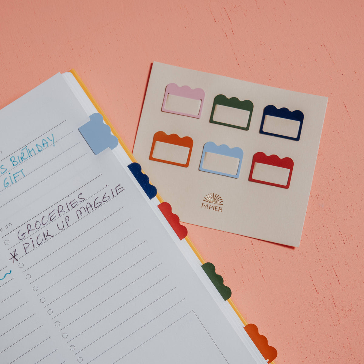Papier Metal Index Tabs, Multicolor Cloud, with tab dividers on a peach surface.