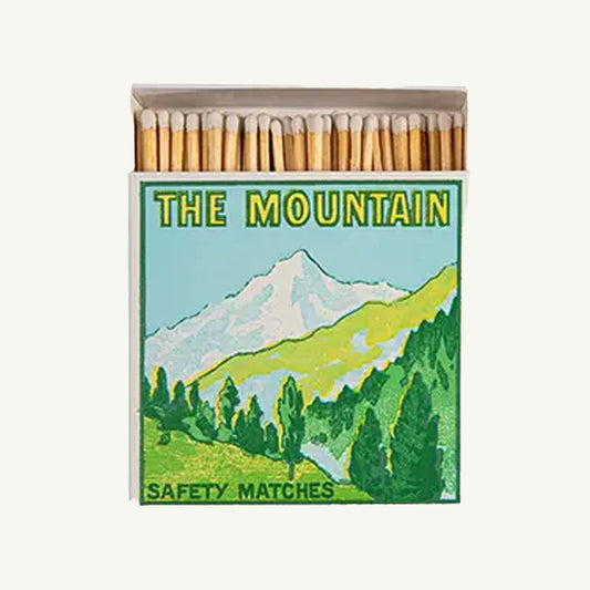 Archivist Letterpress matchbox: "The Mountain" with green mountain graphic on front.