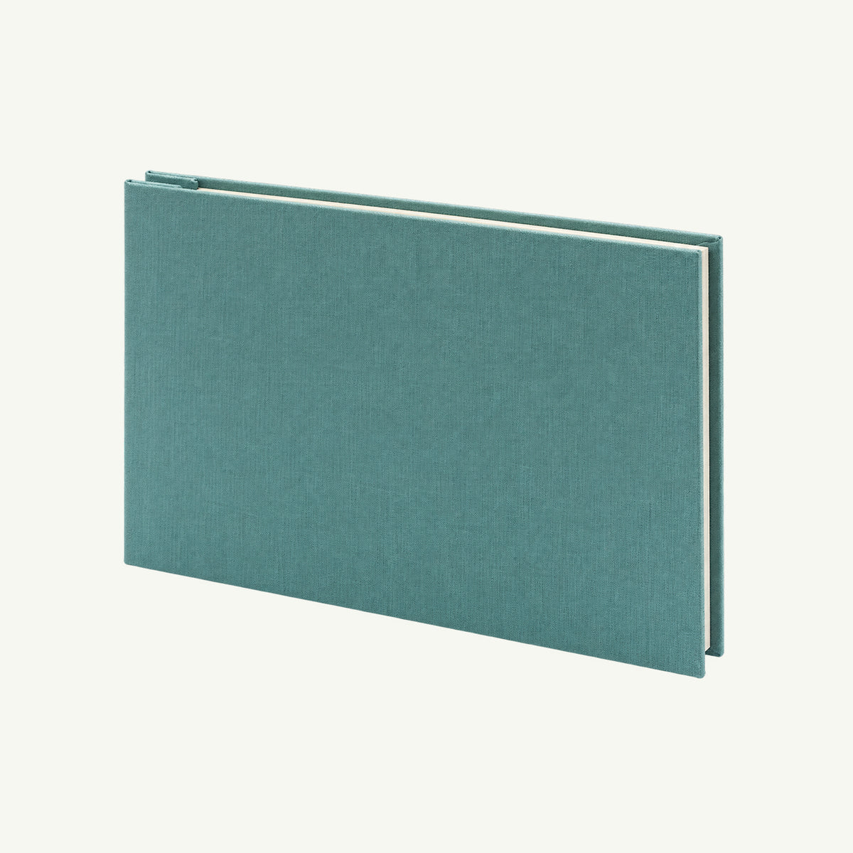 Teal Linen Post Photo Album by Orange Art rests closed on a plain background, cream pages inside.
