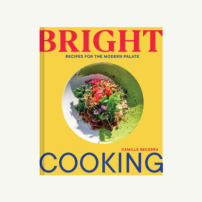 Bright Cooking cookbook cover with a plant-forward salad and green puree on yellow.