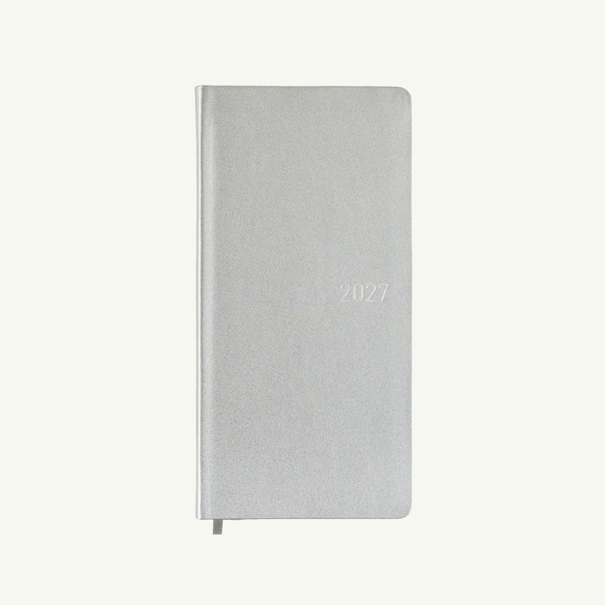 A closed silver Hobonichi Techo 2027 Weeks with thin paper and ribbon bookmark on white.