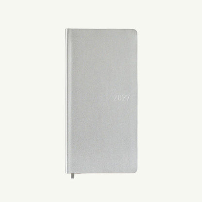A closed silver Hobonichi Techo 2027 Weeks with thin paper and ribbon bookmark on white.
