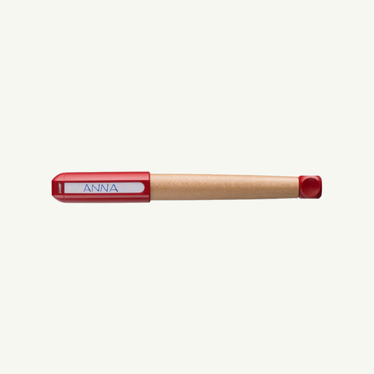 Wooden Lamy ABC Fountain Pen, ergonomic grip, red cap, labeled ANNA on white background.