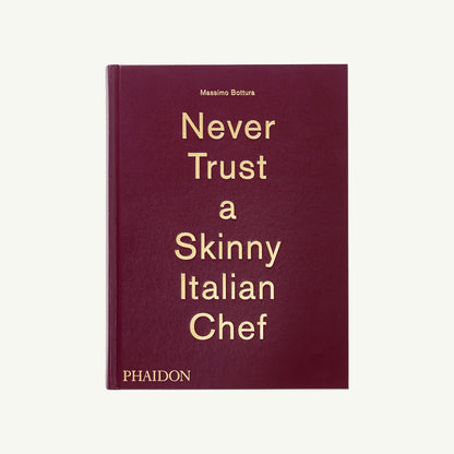 A maroon Phaidon cookbook titled Never Trust a Skinny Italian.