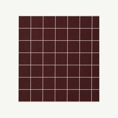 Kinshipped Recycled Gift Wrap: a grid of dark brown tiles with white grout on white background.