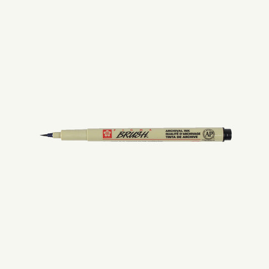 Sakura Pigma Sketch Pen in beige with black tip, labeled, on white background.