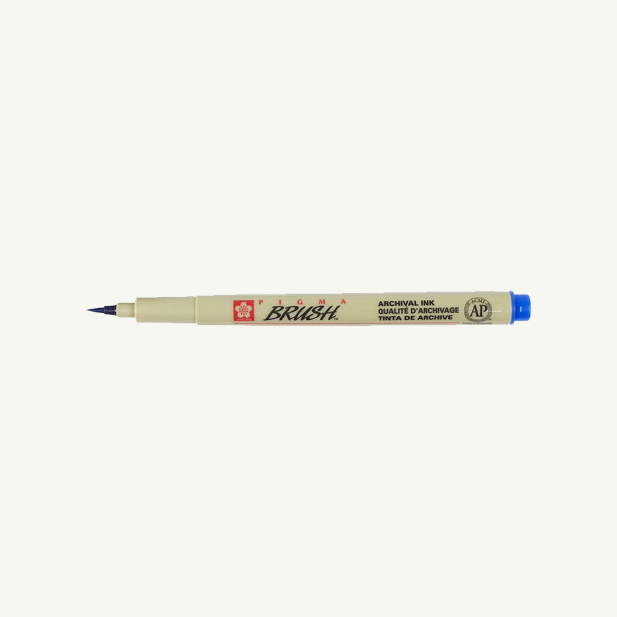 Sakura Pigma Sketch Pen in beige with blue cap on a plain white background.