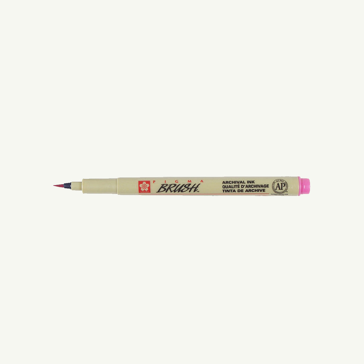 Sakura Pigma Sketch Pen with pink cap, tan body, shown horizontally on a white background.