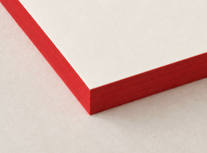 Mr. Boddington’s Studio Weekly Desk Planner Notepad with red edges on a light surface.