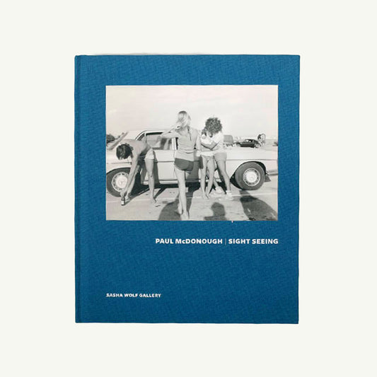 Sight Seeing by Paul McDonough: 1970s photos of women in swimsuits by cars.