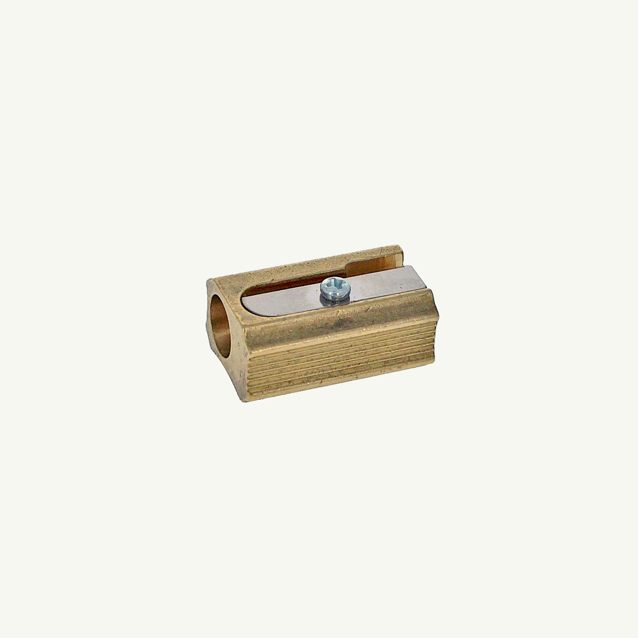 Sweet Bella Single Block Brass Sharpener with metal blade, angled view on plain background.