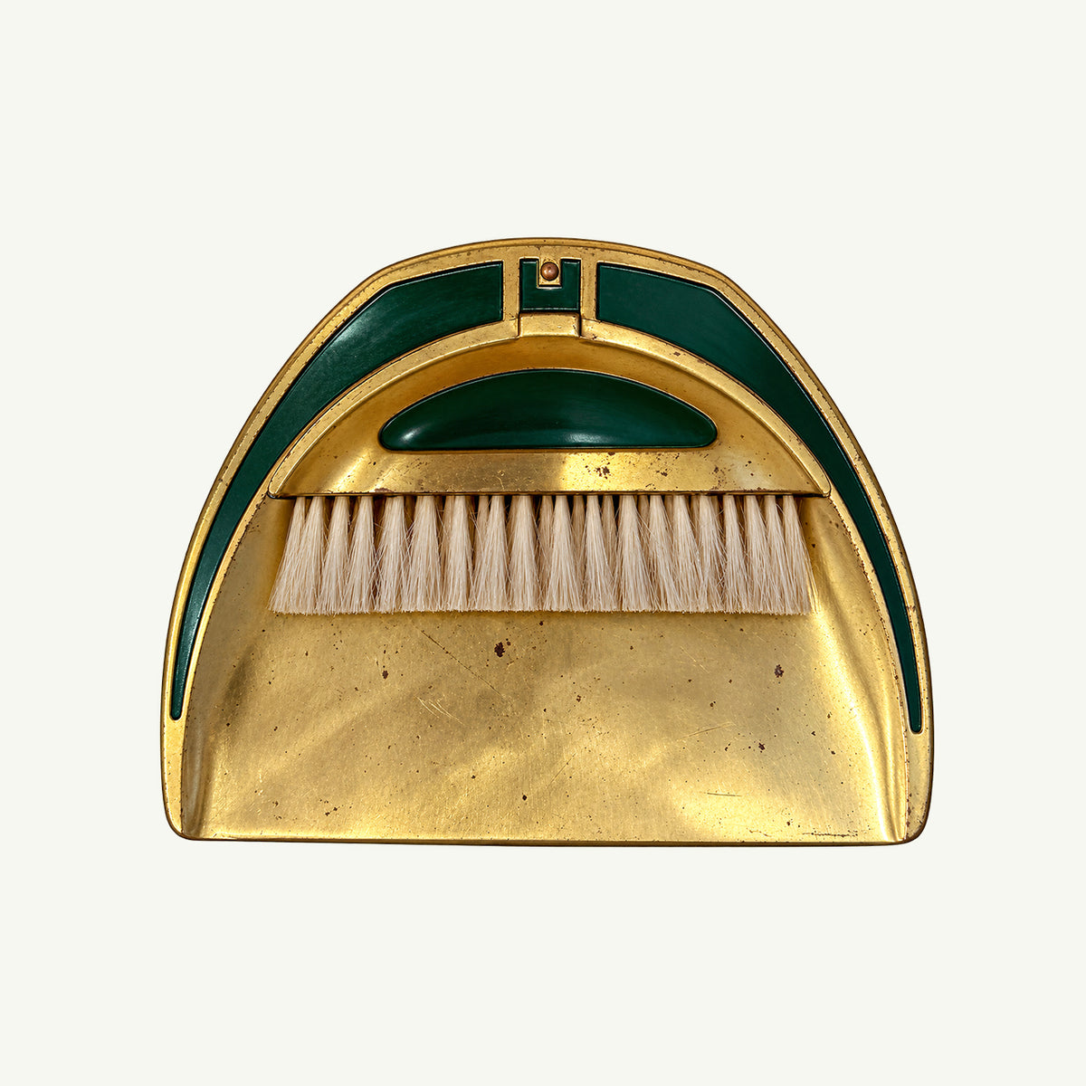 Mr. Boddington’s Studio Vintage Brass & Green Desk Sweeper shown bristles up on plain background.