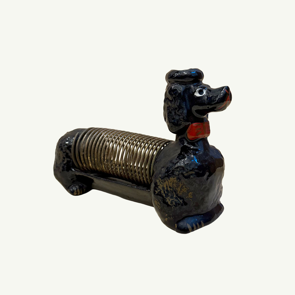 Vintage Japanese Letter Organizer shaped like a black poodle with a brass coil body.