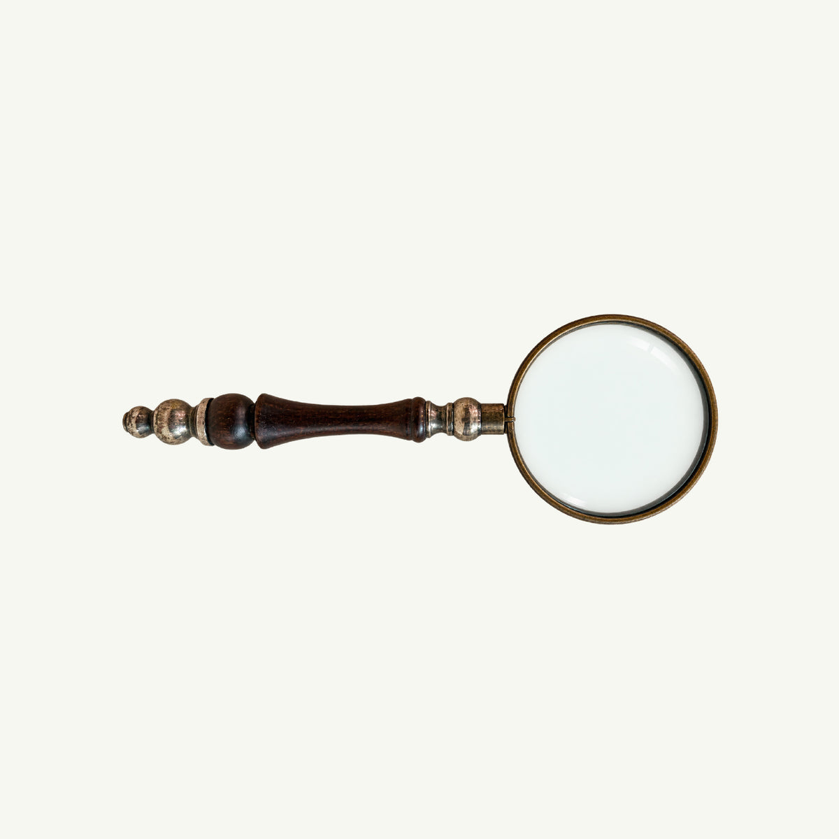Mr. Boddington’s Studio Vintage Magnifying Glass with silver frame and ornate wood handle.
