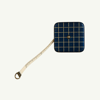 Mr. Boddington’s Studio Vintage Pocket Measuring Tape, blue with grid, partially extended.