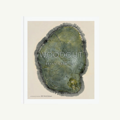 Woodcut book cover featuring a green woodcut print of tree rings by Bryan Nash Gill.