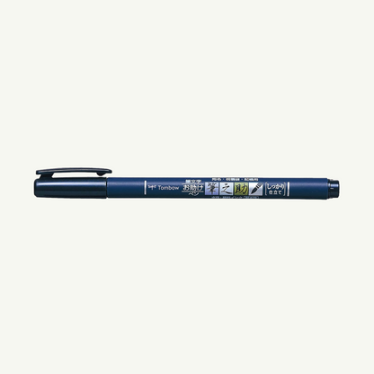 A Tombow Calligraphy Brush Pen, black with cap on, side view against a white background.