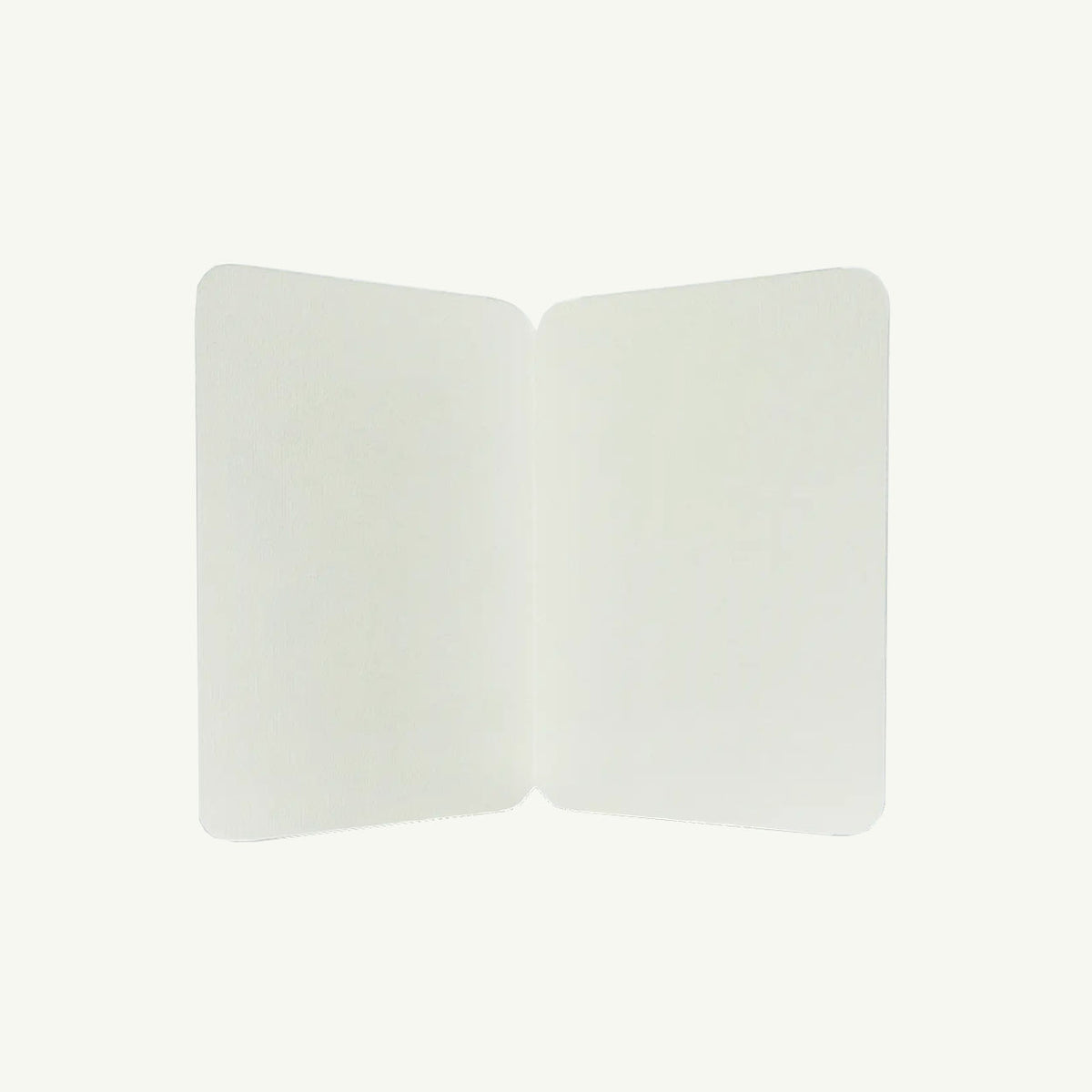 Pastel & Orange Rosette Greeting Card by Canonbury Press on display like fine art on plain backdrop.